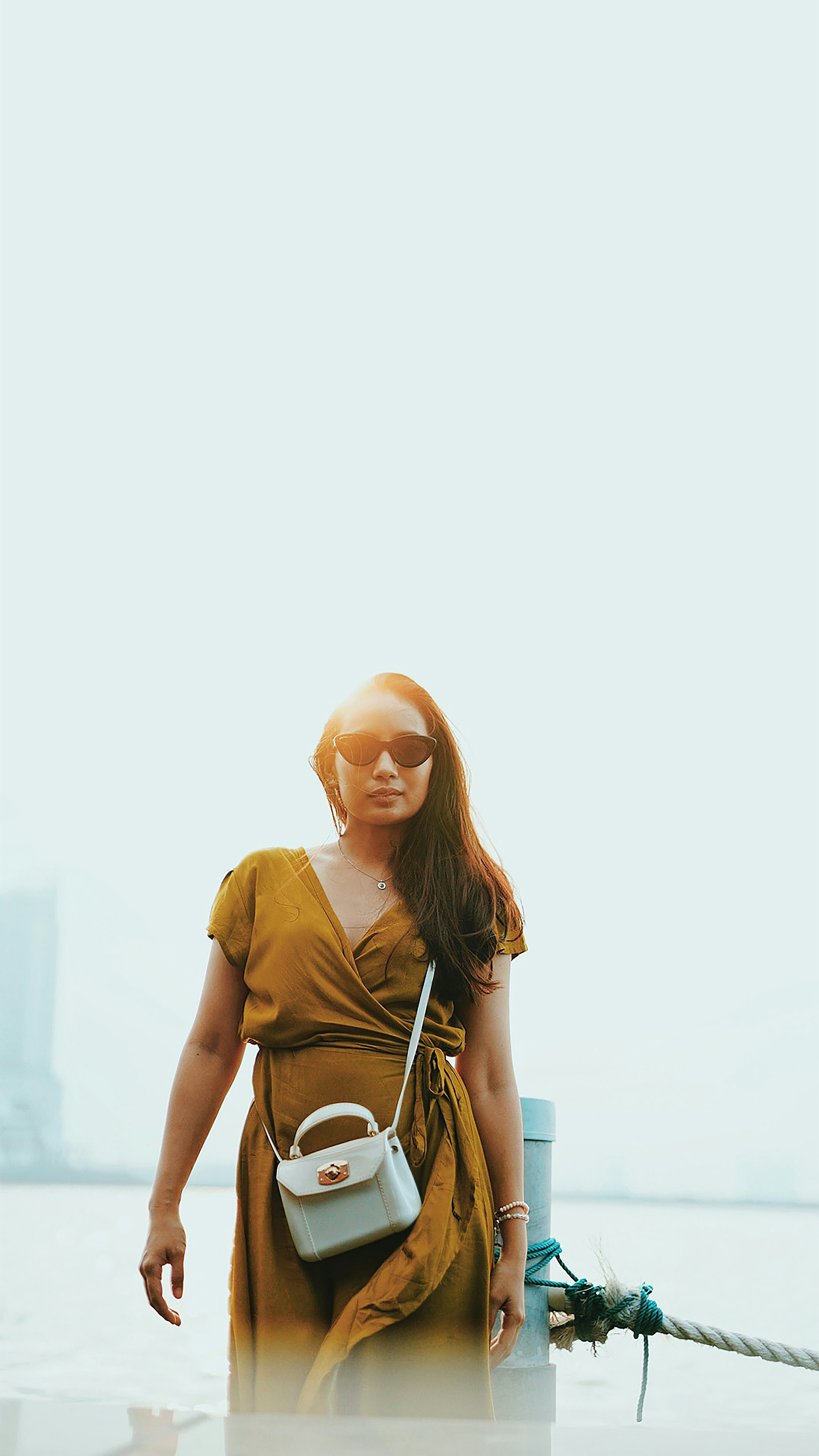 woman in brown crew neck t-shirt wearing brown sunglasses